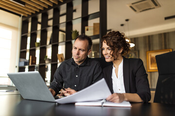 Two business people working together, portrait.