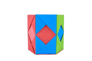 One yellow pencil holder made with small craft paper and nicely placed on a paper background