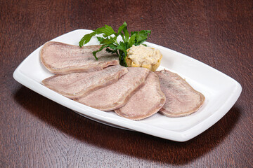 Sliced beef tongue on the plate
