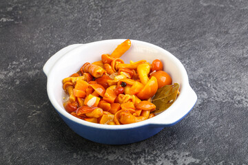 Marinated pickled honey mushrooms in the bowl