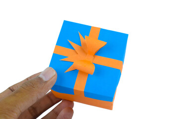 Person holding a hand-made paper box placed on top of a white isolated paper background