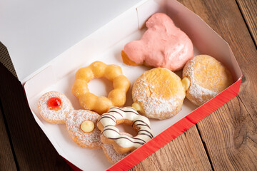 Different type of donuts set, sweet donuts in a paper donut box dessert snack food.