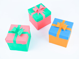 Person holding three different color card with a very nice smiley drawn on them