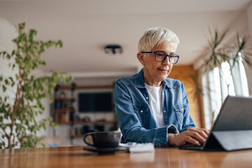 Mature woman, holding a business meeting.