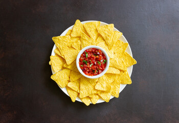 Corn chips nachos with salsa dip. Mexican food. Vegetarian food.