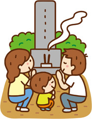 墓参りする家族
