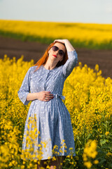 Pregnant woman on the summer field