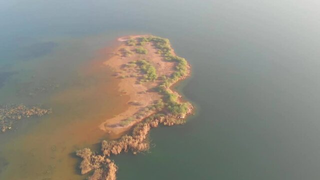 Aerial View Of Island In Keenjhar Lake In Thatta In Pakistan. Pan Right
