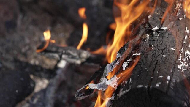 Abstract Of A Burning Wood In Fire With Orange Swirling Flame. - Close Up Shot