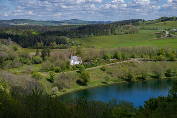 Naklejka premium The view from above of the Weinfelder Maar and the Weinfelder Chapel