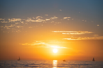 Fototapeta premium Sea beach with sunset sky abstract background. Copy space of summer vacation and travel concept.
