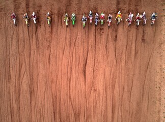 Starting glade Motocross. Athletes at the start. Motorcycle racing. Photo from the drone. Photo...