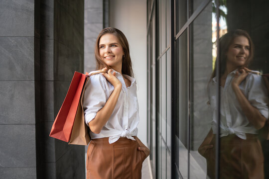 portrait of happy woman with shopping bags