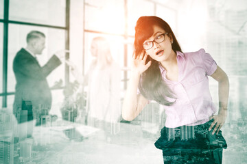 Businesswoman eavesdropping her argued colleague