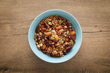 Granola, muesli with nuts for breakfast in a bowl, healthy food, diet.