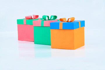 Three various colored miniature gift box made different colored paper and lace