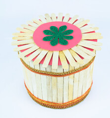 Tissue box made with some small wooden ice cream sticks stacked together