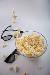 Movie items, 3D glasses and popcorn in a cup