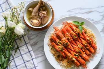 Steamed shrimp and chicken soup on the table