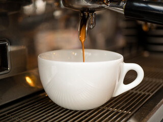 espresso coffee, espresso preparation pours coffee