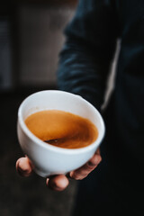 Professional barista makes cappuccino - morning in a coffee shop
