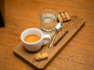 espresso with water and biscuits