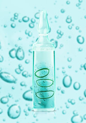 Aloe vera slices and gel cosmetic texture in glass bottle ampoule on blue bubbles background with clipping path close-up, Liquid gel or serum bubbles. Beauty skin care concept Beauty and spa.