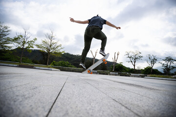 Skateboarder skateboarding outdoors in the morning