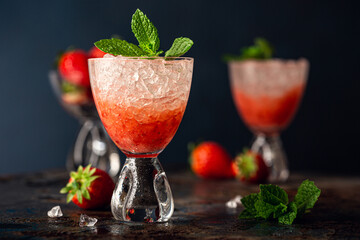 Fresh cocktail with crushed ice, strawberry and mint