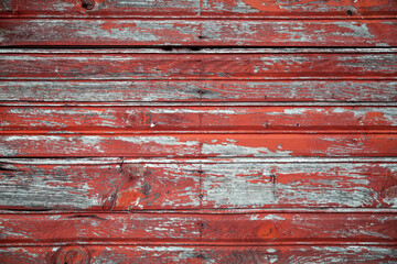 Old weathered board painted red