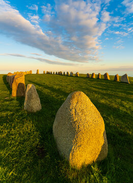 Ale Stones (Ales stenar) Is a megalithic monument of 59 large boulders and is 67 meters long. This landmark is located in K&aring;seberga, Sweden. Photo taken during summer sunset.