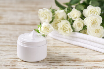 Moisturizing cosmetics, luxury natural face or body cream sensitive skin in a jar on a wooden table, copy space for text.