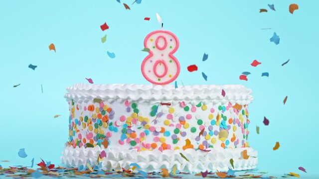 Birthday Cake With Burning Colorful Candle with Number 8 on Pastel Background. Falling confetti. Super Slow Motion, 1000 FPS.