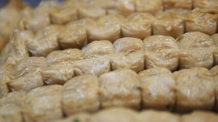 Selective focused uncooked crab meat rolls in  market.