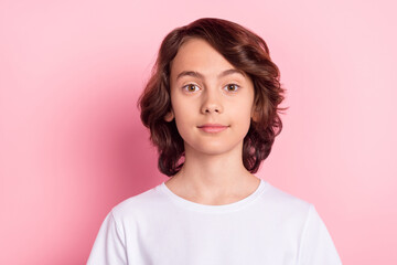 Photo of small pupil boy wear white t-shirt isolated on pastel pink color background