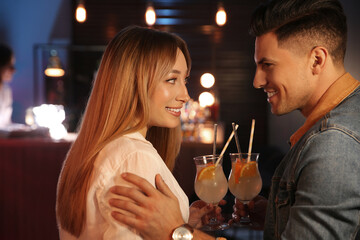 Man and woman flirting with each other in bar