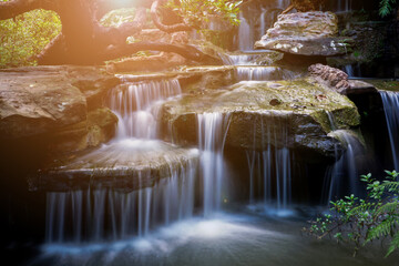 Blurred background,The waterfall at Wat Tham Pha Daen in Sakon Nakhon Province is a new tourist destination.