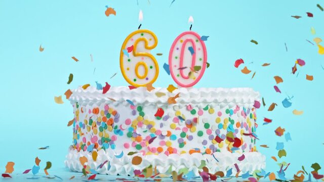 Birthday Cake With Burning Colorful Candles with Number 60 on Pastel Background. Falling confetti. Super Slow Motion, 1000 FPS.