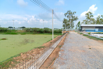 Soil retaining walls prevent road collapse.