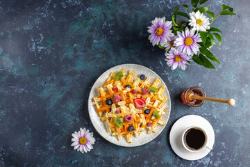 Homemade belgian waffles with honey.