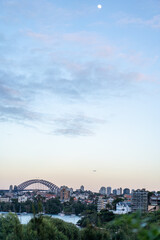 Sydney city skyline at sunset with the famous Sydney Harbour Bridge