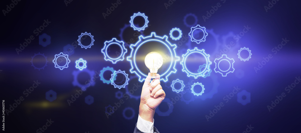 Poster creative and business idea concept with glowing light bulb in man hand and digital gears on abstract