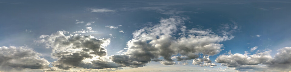 blue sky with beautiful dark clouds before storm. Seamless hdri panorama 360 degrees angle view with zenith for use in 3d graphics or game development as sky dome or edit drone shot