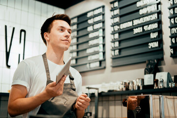 Favorite job in the service sector. The waiter works in a restaurant, keeps a record of expenses...