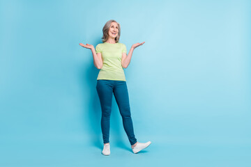 Full length body size photo senior business woman laughing unsure got doubt shrug shoulders isolated pastel blue color background