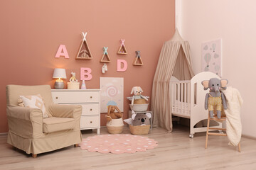 Baby room interior with stylish furniture and comfortable crib © New Africa