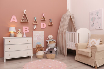 Baby room interior with stylish furniture and comfortable crib