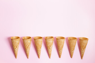 Ice cream cones on pink color background.