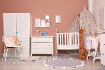Baby room interior with stylish furniture and comfortable crib © New Africa