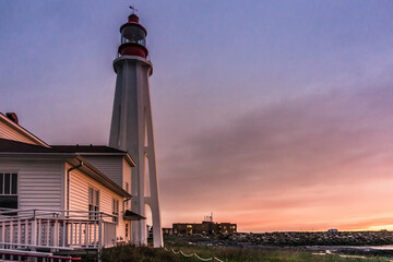 After the rain, incredible sunset over the Pointe au Pere lighthouse in Rimouski, Quebec (Canada)